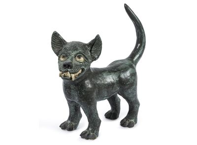 a small statue of a cat on a white background