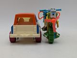 a toy truck with a bike attached to the back of it