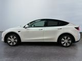 a white tesla model x parked in a white room