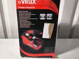 the box of a vacuum cleaner is sitting on a table