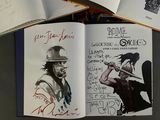 a book with a drawing of a man holding a baseball bat