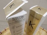 two boxes of kerastase hair products sitting on a basket