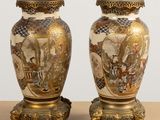 pair of asian vases on stand on table with white background