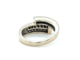 silver ring with black stones on a white background