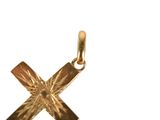 gold plated cross pendant with a starburst design in the center