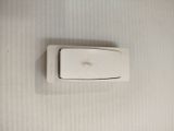 a white light switch on the wall in a bathroom