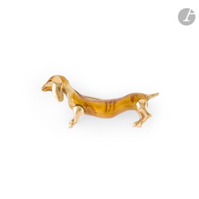 an image of a gold dog broochle on a white background