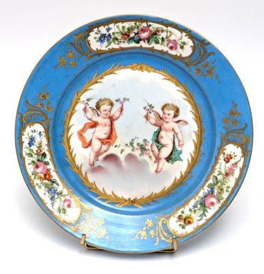 a blue plate with a picture of two cherensils on it