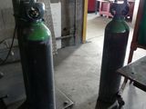 two cylinders that are next to each other in a room