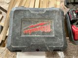 a tool box with a hammer and other tools sitting on a table