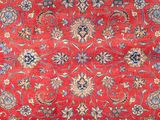an image of a red rug with a floral design on it