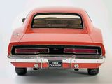 a red car that is sitting on a white surface