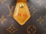 a close up of a louis vuitton bag with a monogram on it