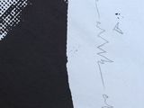 a piece of paper with writing on it on the ground