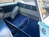 a view of the inside of a car from the driver ' s seat