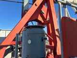 a crane that is sitting on the side of a building