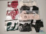 several pairs of underwear are wrapped in plastic bags on a table