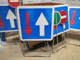 many signs that are sitting in a room together
