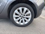 a close up of a car ' s tire on the street