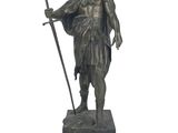 bronze statue of a man with a sword and shield on a white background