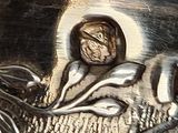 a close up of a metal object with a picture on it