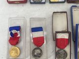 some of the medals and medals are displayed on the table