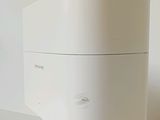 an image of a white toilet with the lid up