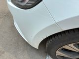 a close up of a car ' s front tire with a flat tire