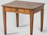 an old wooden table with a drawer on top of it