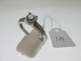 a ring with a diamond on it and a price tag