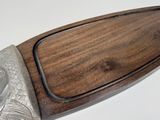 a knife that is sitting on top of a cutting board