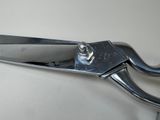 a close up of a pair of scissors on a table