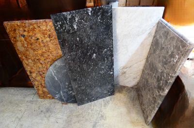 four different types of granite on display in a store