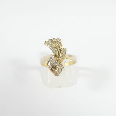 a gold ring with a diamond snake on top of it