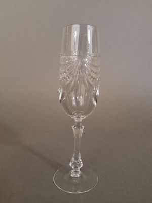 a wine glass that is sitting on a table