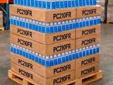 boxes of water are stacked on a pallet in a warehouse
