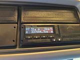 a radio in the center of a car with a clock on it