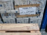 a pallet that is sitting on the floor next to a stack of boxes