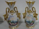 two vases that have been painted with flowers on them