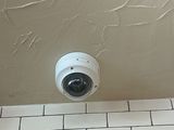 an image of a bathroom with a camera on the wall