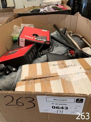 a cardboard box filled with assorted items in a room