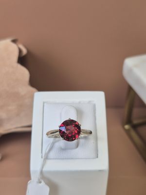 a ring that is sitting in a box on a table