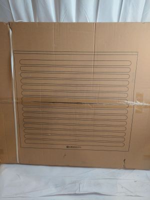 a cardboard box that is sitting on a bed