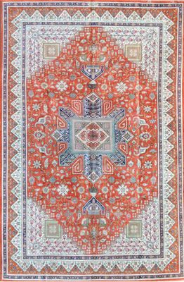 an orange and blue rug with a medallion design