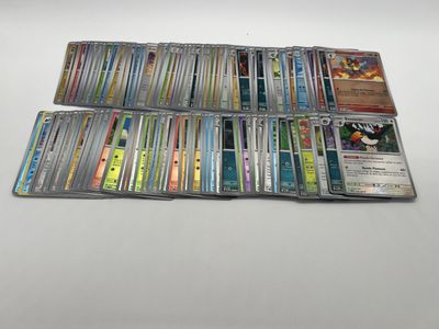 a large collection of pokemon trading cards on a table