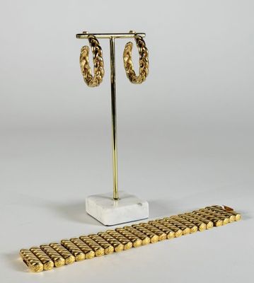 ANONYME, parure comprenant un bracelet manchette en métal do…