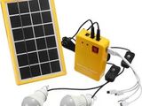 a yellow solar panel with two light bulbs and a charger