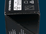 a black box that has a yellow cord in it