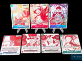 several cards of different colors and designs on a black background