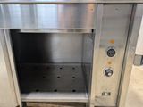 a stainless steel oven that is open and ready to be used